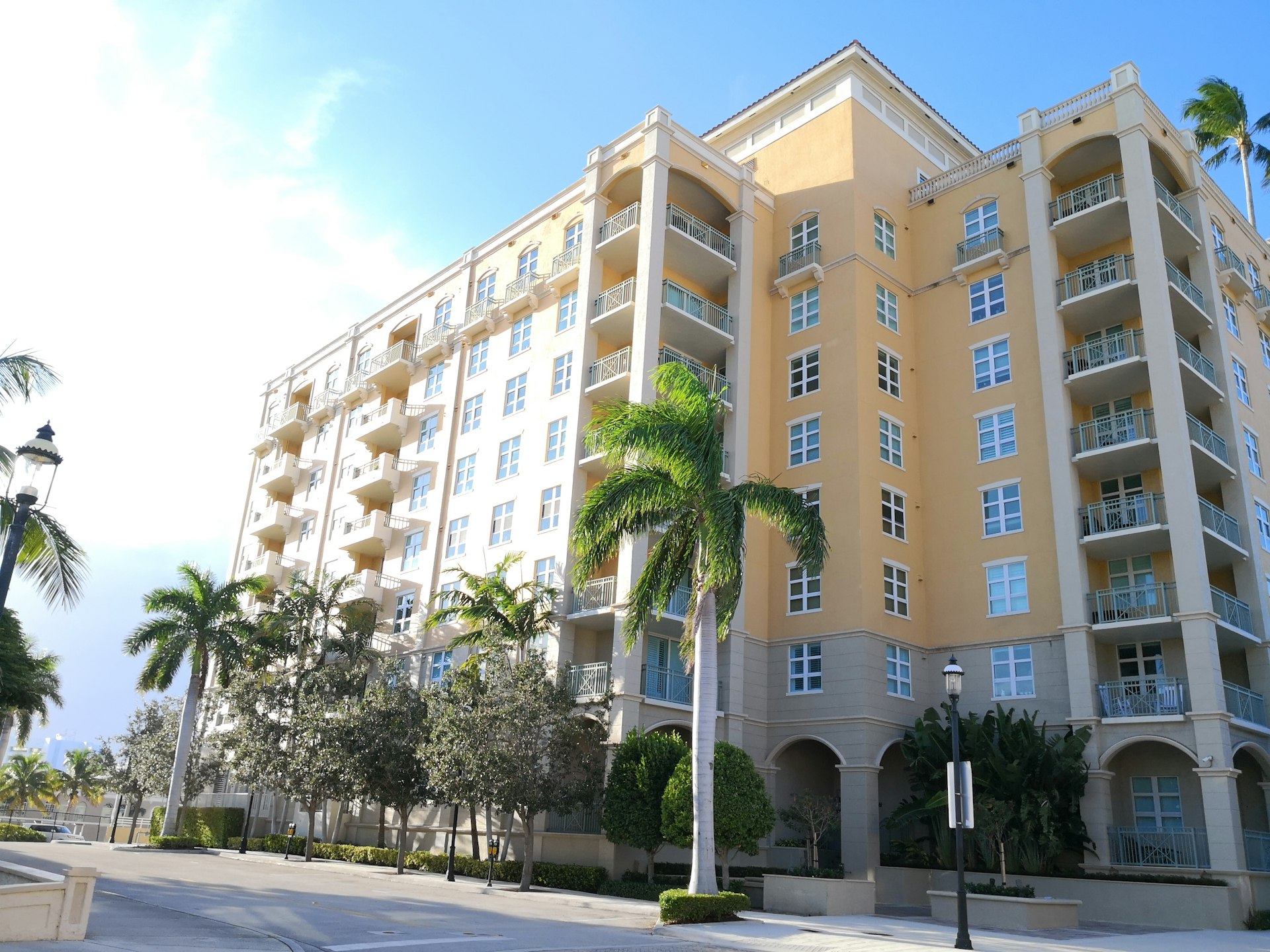 a building with palm trees in front